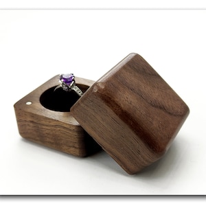 Wooden engagement ring box from one piece of walnut wood. Wooden ring box proposal. Unique ring bearer box for wedding.