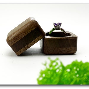 High quality wooden ring box from walnut. Unique wood engagement ring holder. Art wood ring case proposal.