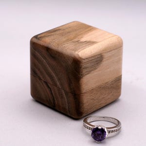 Wooden ring box for wedding from European walnut wood. Art wood ring holder  proposal. Unique wood engagement ring holder.
