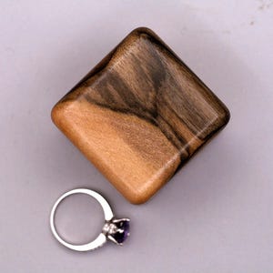 Art wooden ring box for wedding from European walnut wood. Wood ring holder  proposal. Unique wood engagement ring holder.