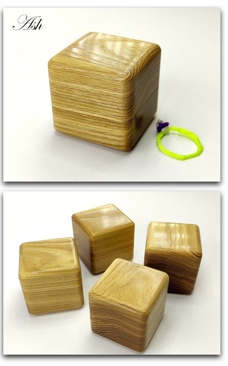 May include: Four wooden boxes with a light brown wood grain finish. The boxes are square and have a smooth, polished surface. The boxes are arranged in a group, with one box in the center and three boxes surrounding it.