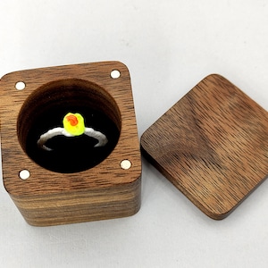 Unique wood engagement ring holder from walnut wood. Elegant ring bearer ideas. Custom wooden ring box proposal.