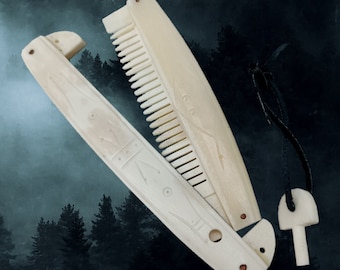 May include: An off-white, folding comb with detailed carved patterns. The comb is open, showing the teeth, and is attached to a small, mushroom-shaped pendant by a black cord. The backdrop is a dark, misty forest scene.