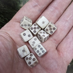 Small Bone Viking Dice with Dot and Ring Marks in Hand x 10