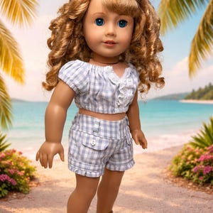 May include: A doll with blue eyes and curly blonde hair, wearing a blue and white checkered crop top and shorts set. The doll is also wearing white sandals. The background features a beach scene with palm trees and a blue sky.