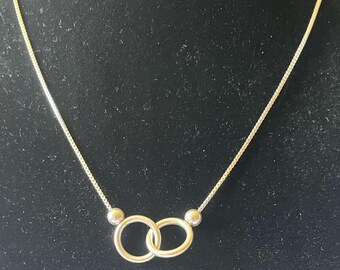 Two Sterling Silver Circles Entwined to Infinity Necklace