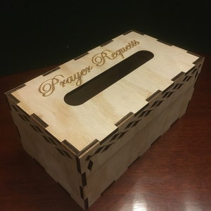 May include: A wooden box with a slot for tissues and the words "Prayer Requests" engraved on the top.