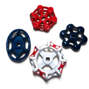 May include: Four vintage water valve handles in red, white and blue. The handles are made of metal and have a starburst design.