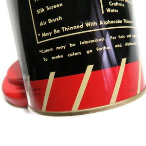 May include: A vintage can of paint with a red and black label. The label says "Silk Screen", "Air Brush", "Craftmix", "Water", "* May Be Thinned With Alphacolor Thinners", "*Colors may be intermixed. For tints add more water. To make colors go farther, add Alphacolor Thinners." The can also says "Made in U.S.A."