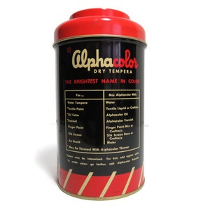 May include: A red and black tin can with the text "Alphacolor Dry Tempera The Brightest Name in Color" on the front. The can lists instructions for mixing the tempera paint with water, textile liquid, oil, varnish, and other mediums.