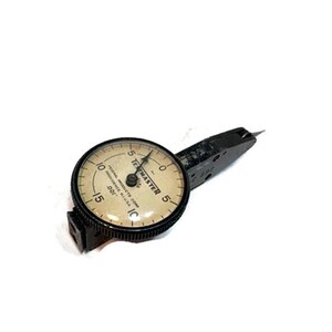 May include: A vintage black and silver dial indicator gauge with a needle pointing to the number 5. The gauge face is off-white with black numbers and the text "FEDERAL PRODUCTS CORP. PROVIDENCE, R.I. U.S.A. .001".