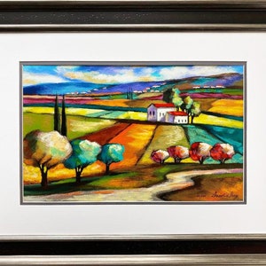May include: A colorful painting of a rural landscape with a white house, green trees, and a winding path. The sky is blue with white clouds. The painting is framed in a dark wood frame.