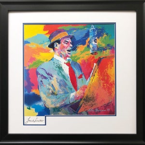 May include: A colorful, abstract painting of Frank Sinatra singing into a microphone. The painting is signed "LeRoy Neiman '95" in the bottom right corner. The painting is framed in a black frame with a white mat.