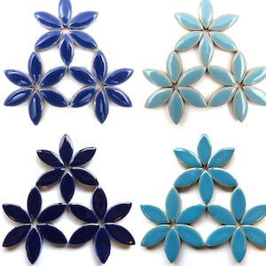 May include: Four sets of blue and turquoise ceramic flower-shaped tiles arranged in a triangular pattern.