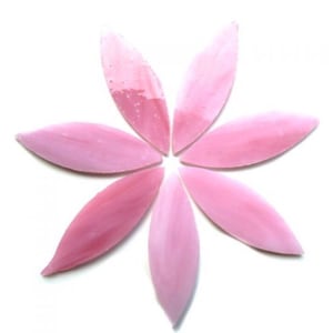 May include: A flower-shaped arrangement of seven pink, petal-like glass pieces. The petals are in varying shades of pink, with some appearing more translucent. The arrangement is centered on a white background.