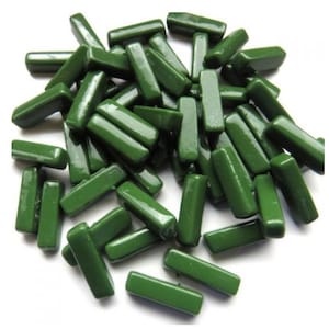 May include: A large quantity of dark green glass tiles in a rectangular shape. The tiles are glossy and have a smooth surface.