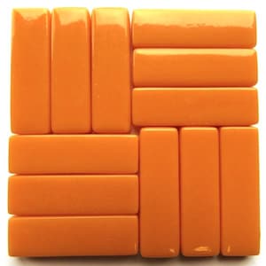 May include: A collection of rectangular orange beads arranged in a grid pattern. The beads have a glossy finish and are a solid, vibrant orange color. The arrangement suggests a mosaic or decorative element, possibly for jewelry or crafts.