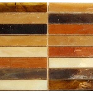 May include: A mosaic tile sheet with a variety of brown, beige, and white tiles arranged in horizontal rows. The tiles have a slightly iridescent finish.