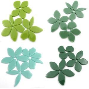 May include: Four sets of glass flower mosaic tiles in green, light green, teal, and dark green.