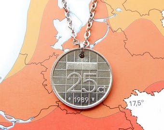May include: A silver-toned coin pendant necklace featuring a 25 cent coin from 1989. The coin has a grid pattern design with the number 25 and the abbreviation ct clearly visible on the face, suspended from a simple silver-coloured metal chain.