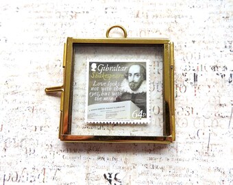 May include: A square brass frame containing a postage stamp featuring a portrait of William Shakespeare. The stamp text reads Gibraltar, Shakespeare, Love looks not with the eyes, but with the mind, A Midsummer-Night's Dream, and 64p.