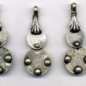 Morocco – 5 Old Silver Pendants with ancient coins held by a hand of fatima
