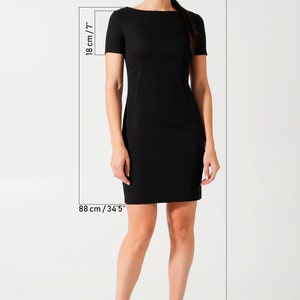 May include: A solid black short-sleeved dress with a boat neckline and a fitted silhouette. The dress is shown with measurement indicators including 18 inches for the sleeve length, 88 cm for the length, and a total height of 5'9 inches.