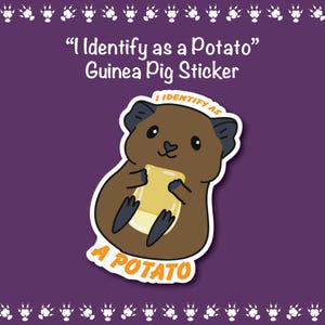 May include: A sticker featuring a cartoon guinea pig holding a yellow rectangle, with the text "I Identify as a Potato" and "A Potato". The guinea pig is brown with black ears and feet, set against a purple background.