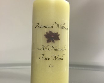 May include: A yellow plastic bottle with a black lid and a white label that reads "Botanical Wellness - All Natural - Face Wash 4 oz."