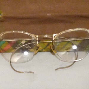 vintage COC 1/10 Lunettes sans monture remplies d'or 12 carats et étui en tissu et en acier payé.