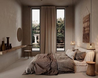 May include: A bedroom with a large bed, a ceiling fan, and a view of a waterfall through the window. The room is decorated in a minimalist style with neutral colors and natural textures.