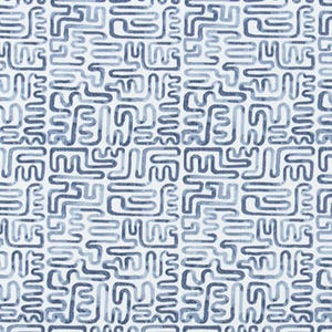 May include: White canvas fabric with a repeating pattern of blue, maze-like shapes. The fabric is labeled "Angela Harris - Minos Indigo Luxe Canvas". The design features varying shades of blue, creating a textured appearance.