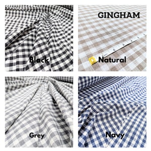 May include: Four fabric swatches of gingham fabric in different colors: black, natural, grey, and navy. The fabric is folded and has a checkered pattern.