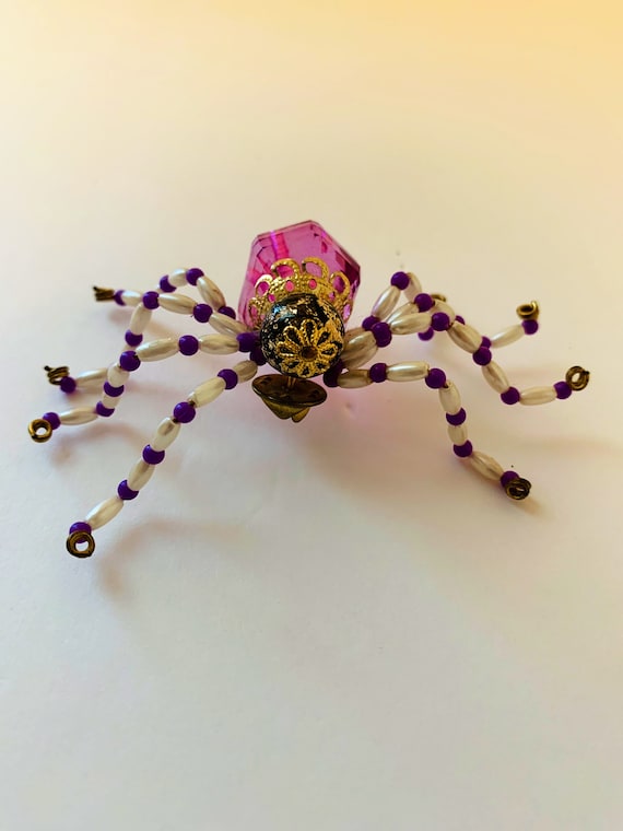 Spider brooch with large facetted purple bead body