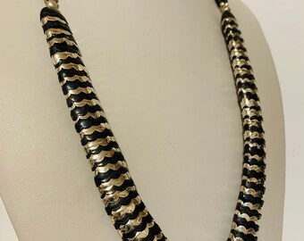 Long black and silver tone necklace layers of black scalloped and silver tone metal scalloped layers with long beads with small round spacer