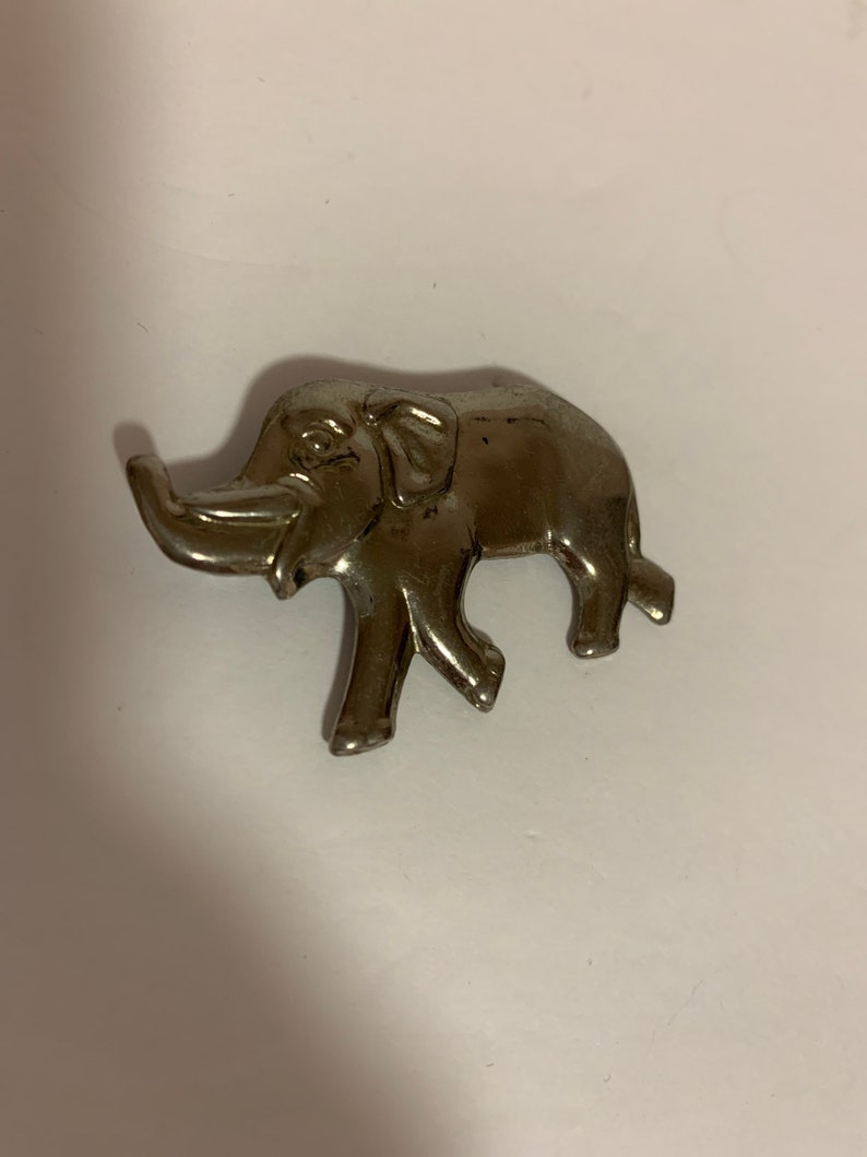 . good luck Silver tone metal elephant brooch with trunk up