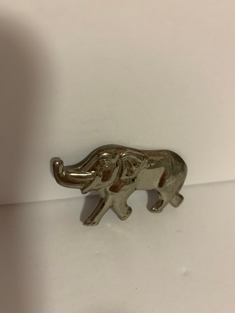 . good luck Silver tone metal elephant brooch with trunk up