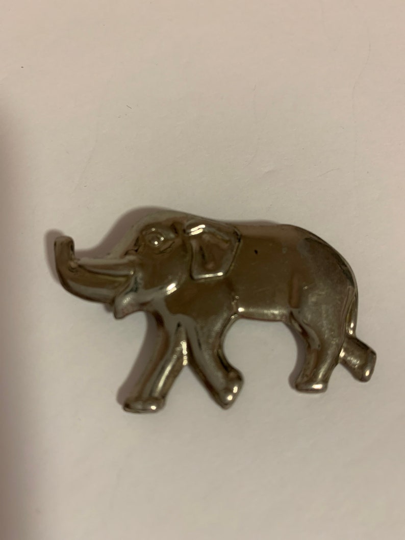 . good luck Silver tone metal elephant brooch with trunk up