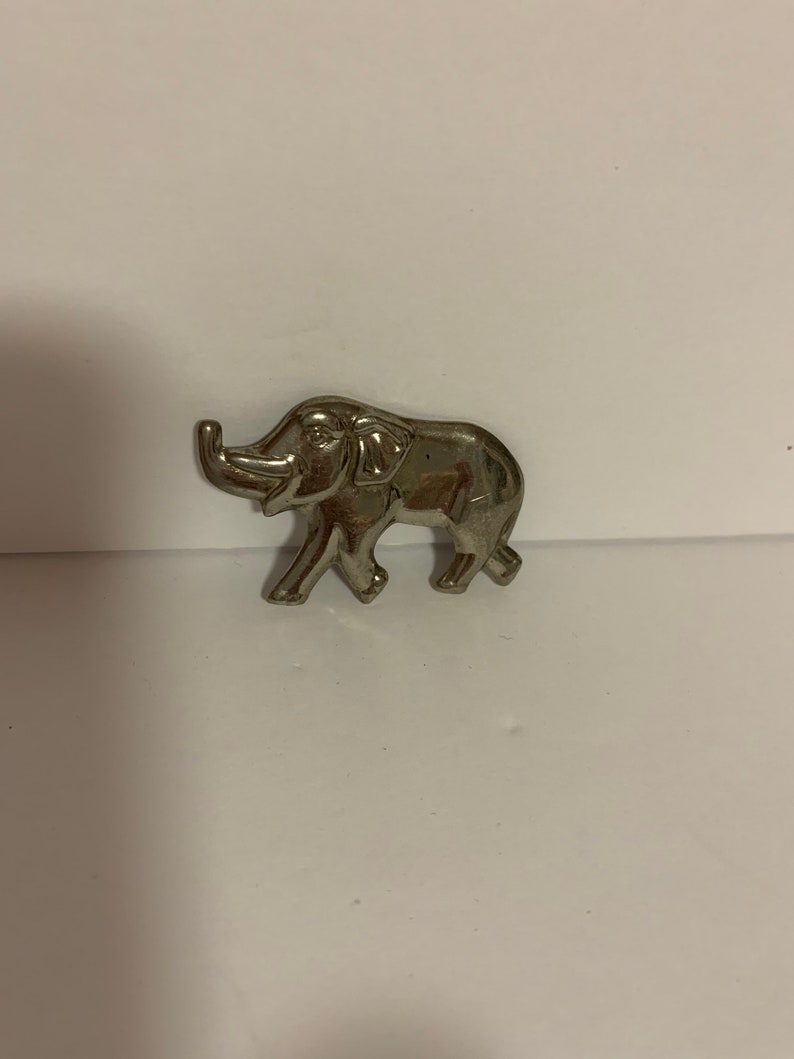 . good luck Silver tone metal elephant brooch with trunk up