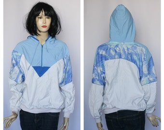 May include: A light blue hooded jacket with a white and blue abstract cloud print. The jacket has a zipper closure and a drawstring hood.
