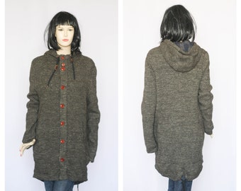 May include: A long-sleeved hooded sweater in a dark gray heather color with a button front and a drawstring hood. The sweater has a relaxed fit and is made of a soft, comfortable fabric.