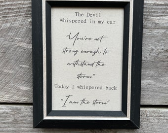 The Devil whispered in my ear you are not strong enough, I am the Storm, Framed Quote, Perserverance quote