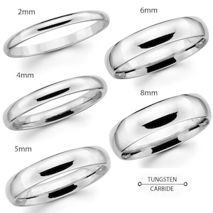 May include: A collection of polished silver tungsten carbide rings in various widths: 2mm, 4mm, 5mm, 6mm, and 8mm. The rings have a smooth, rounded design, reflecting light. The text "Tungsten Carbide" is displayed below the rings.