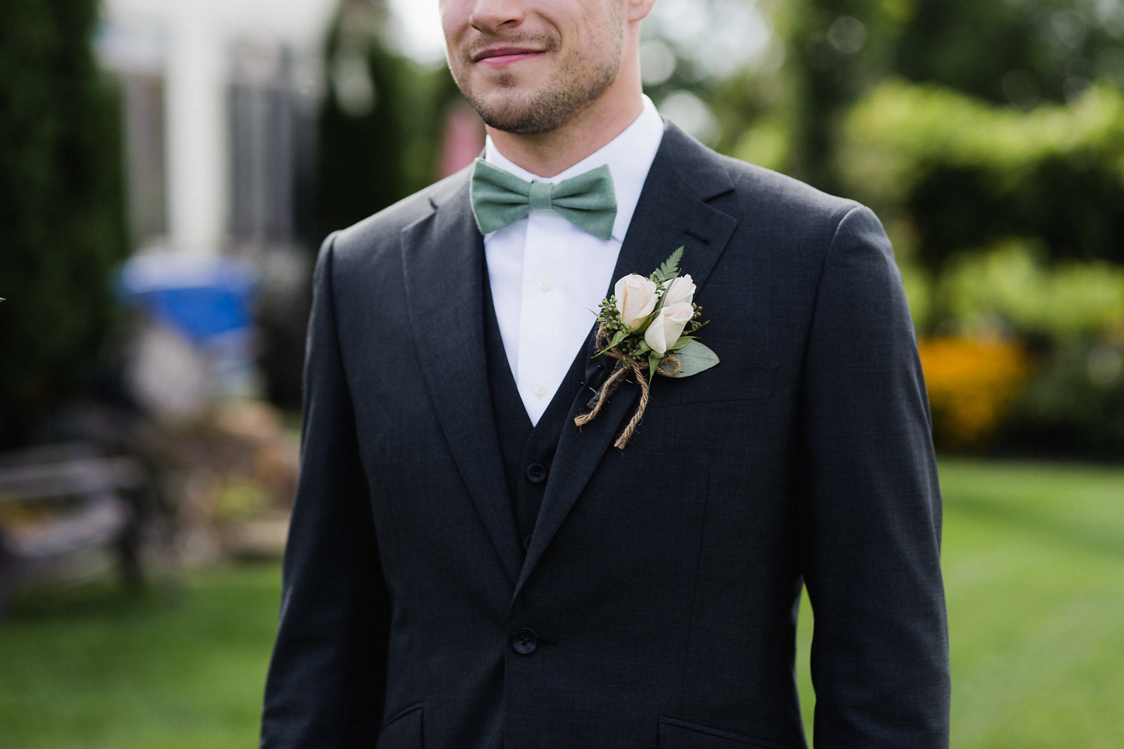 Groom's Navy Suit with Sage Green Bow Tie, August Wedding Attire