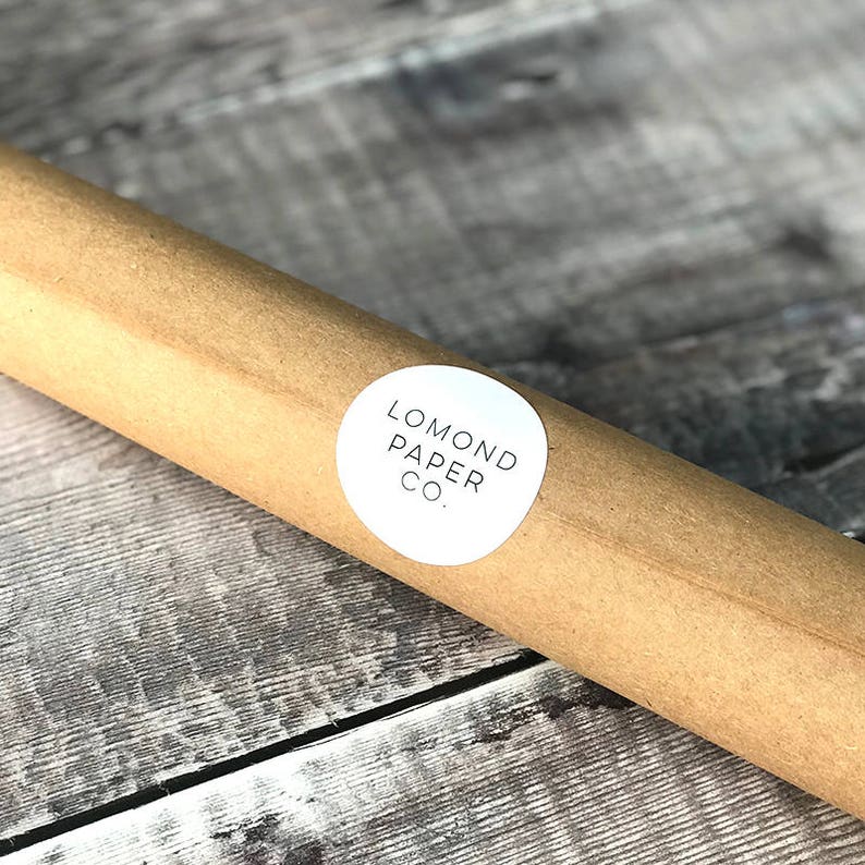 May include: A brown paper tube with a white circular label that says "LOMOND PAPER CO."
