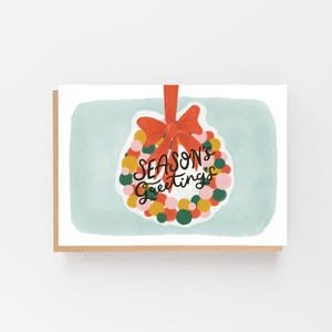 Corona de saludos de temporada - Tarjeta navideña - Tarjeta benéfica