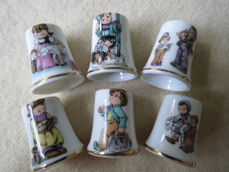 Charming Norman Rockwell Children Sewing Thimble Set of 6 Porcelain Thimbles