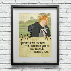 May include: A framed print of a cartoon illustration of a character from the Lord of the Rings. The character is wearing a brown cloak and has red hair. The quote "THERE'S SOME GOOD IN THIS WORLD MR FRODO, AND IT'S WORTH FIGHTING FOR..." is printed below the illustration.