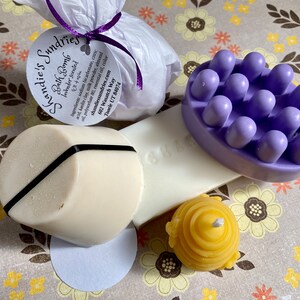 Pamper package- shampoo, shave, and massage soaps plus a bath bomb and a candle so you can luxuriate in the bath.