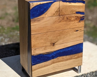 Epoxy river chest of drawers with 6 soft touch open drawers and a custom made metal base frame. Walnut and sea glass.Custom made for Karen W